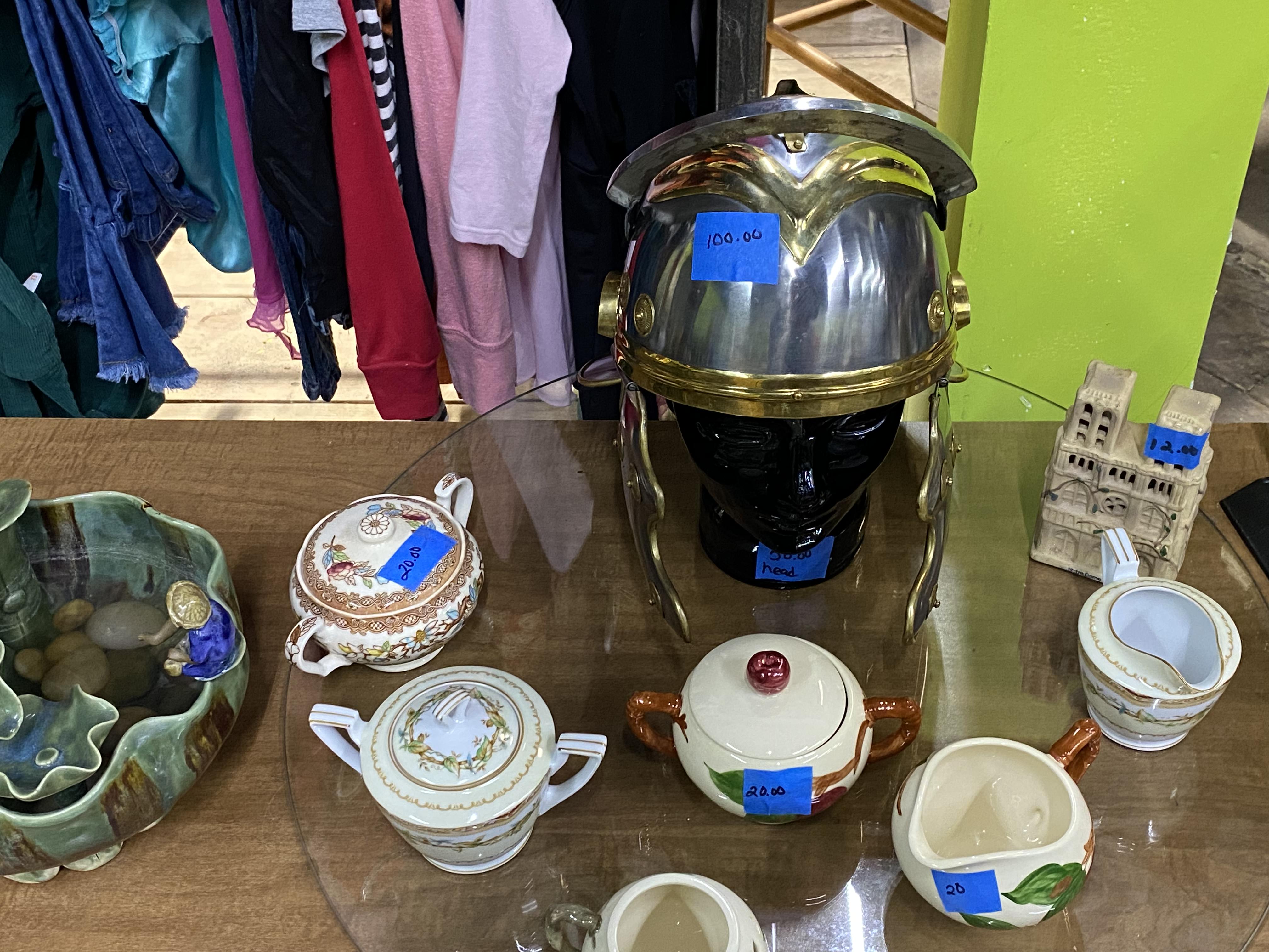 Home décor items including artwork and decorations in thrift store