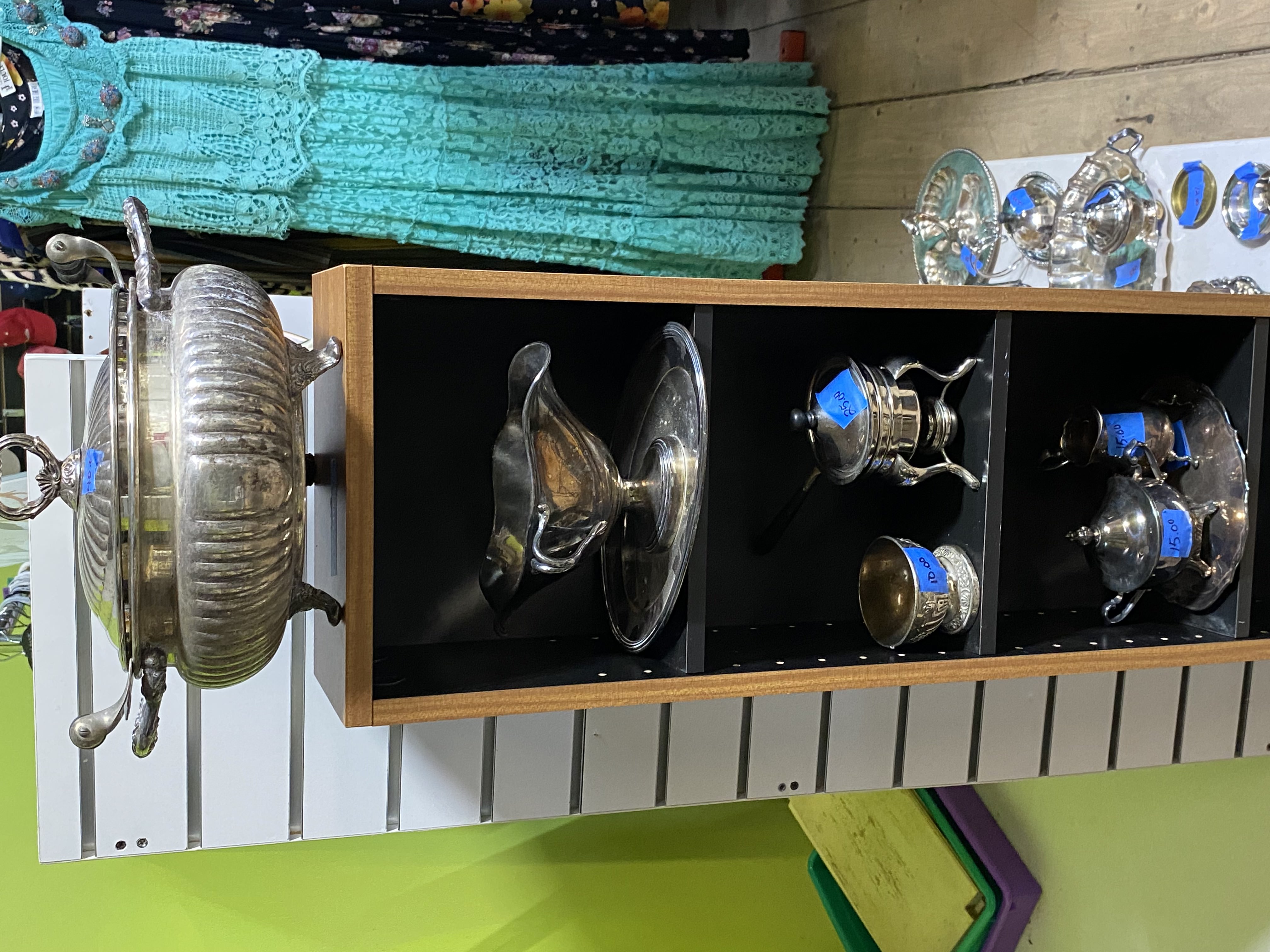 Home décor items including artwork and decorations in thrift store